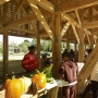Vendors sell produce at the grand opening of the Windsor Farmers Market. (Photo credit: Unknown)
